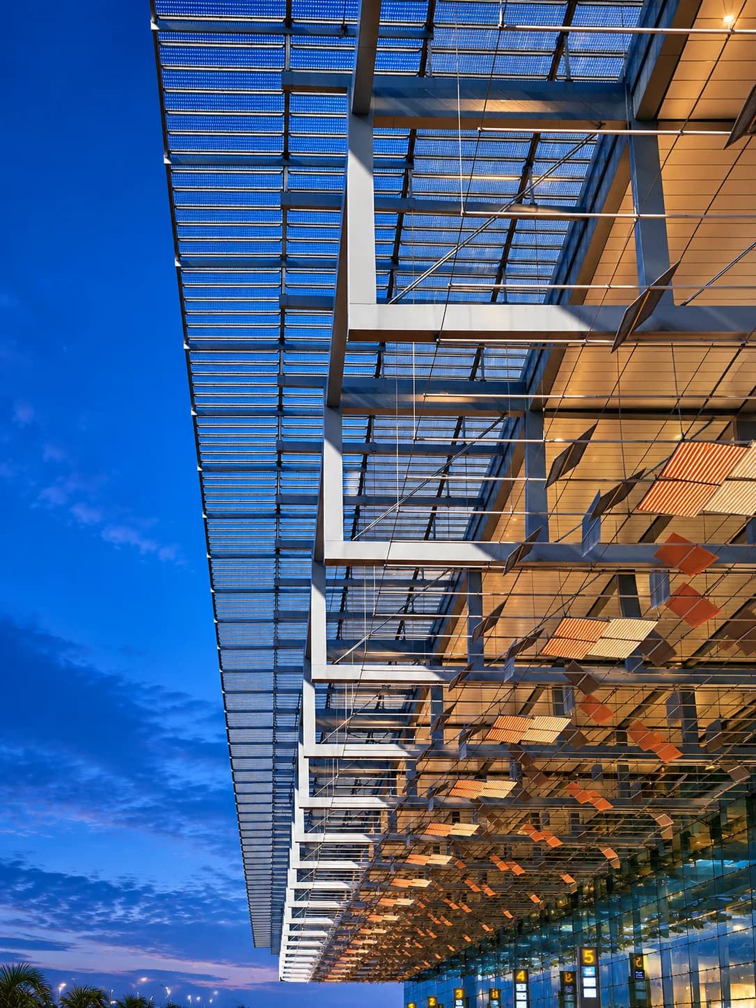Acrylic roof canopy glazing at Changi Airport Terminal 3 at dusk