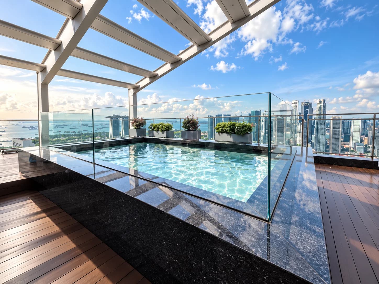 Rooftop acrylic pool overlooking the city skyline at South Beach Residences